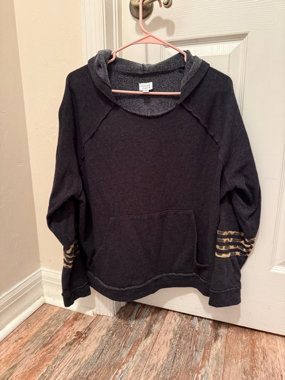 Cozy Black Hooded Sweatshirt with animal print Sleeve Stripes